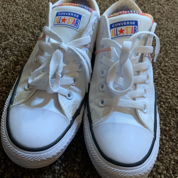 white converse with rainbow stitching